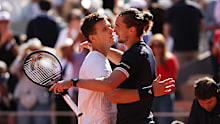 Zverev and Jakub Mensik embrace at the net after their semi-final.