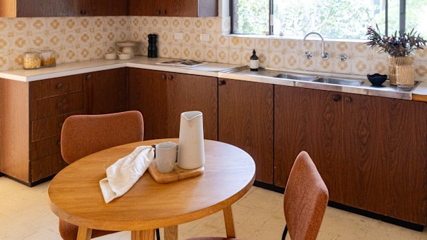 The mid-century apartment is in near original condition, including splashback tiles and a double stainless steel sink.
