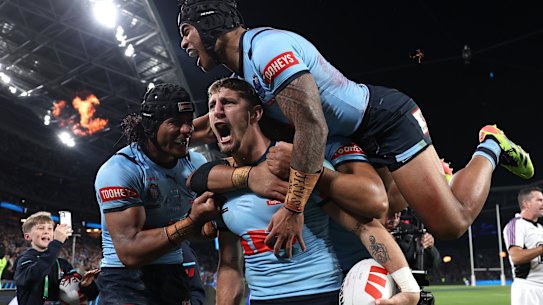 Zac Lomax celebrates his first Origin try.