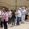 The Electoral Commission of Queensland was caught out by long queues and a shortage of staff and ballot papers at many booths.