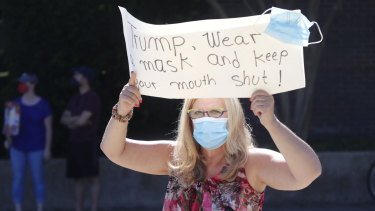 Protesters gathered outside the Dallas venue where President Donald Trump held a race and policing meeting during a fundraising trip.