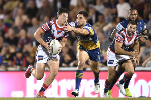 Roosters hooker Sam Verrills darts out of dummy-half in Mackay last night.
