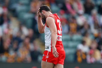 Paddy McCartin walks off the ground after suffering an accidental head knock against Hawthorn.