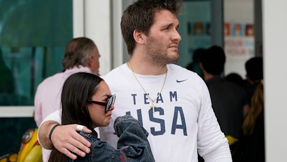 A couple waits for news of their loved ones after the building collapsed.