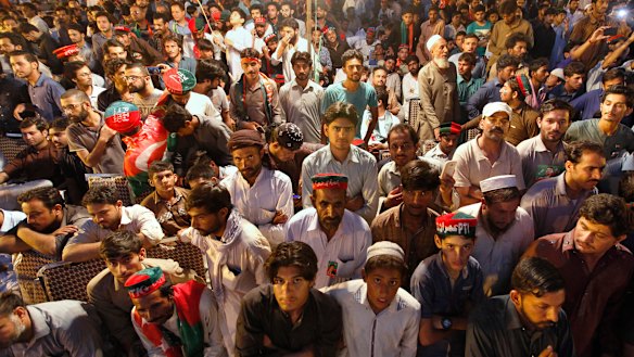 Supporters listen to Imran Khan during an election campaign rally in Islamabad, Pakistan.