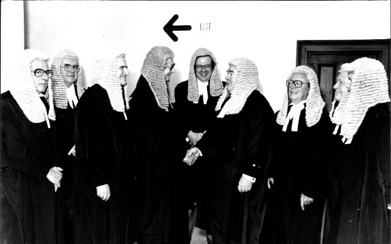 The farewell for Mr Justice Dey in 1981 was attended by premier Neville . Wran at the Industrial Commission.  From left: Justice Perrignon, Justice Macken, Justice Cahill, Justice Dey, Justice Bauer, Justice Fisher, Justice Liddy, Justice Watson and Justice Glynn. 