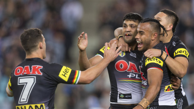 Key man: The Panthers celebrate a Tyrone Peachey try against the Warriors on Saturday.