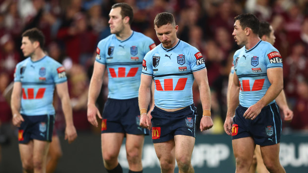 Dejected Blues players after losing this year’s series at Suncorp Stadium.