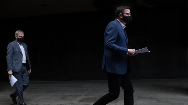 Premier Daniel Andrews leads Chief Health Officer Brett Sutton into the daily briefing.