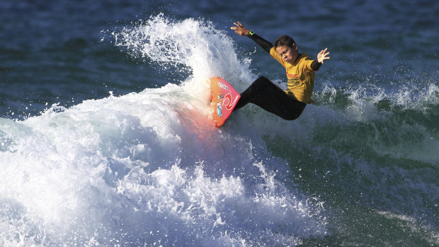 Local Maroubra surfer Jake Feher rides a wave at the state titles at Maroubra Beach on Sunday.