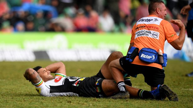 Early casualty: Viliame Kikau goes down in just the third minute of the match.