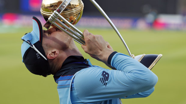 On top of the world: England's Jason Roy kisses the trophy as he celebrates after winning the Cricket World Cup final.