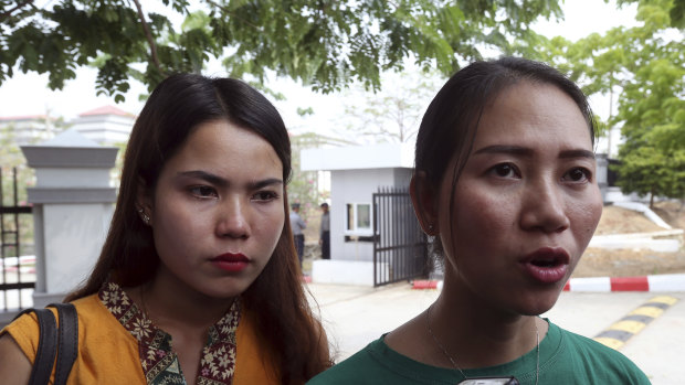 Pan Ei Mon, right, wife of Reuters journalist Wa Lone, talks to journalists as she leaves the Supreme Court along with Chit Su Win, left, wife of Reuters journalist Kyaw Soe Oo, on Tuesday.