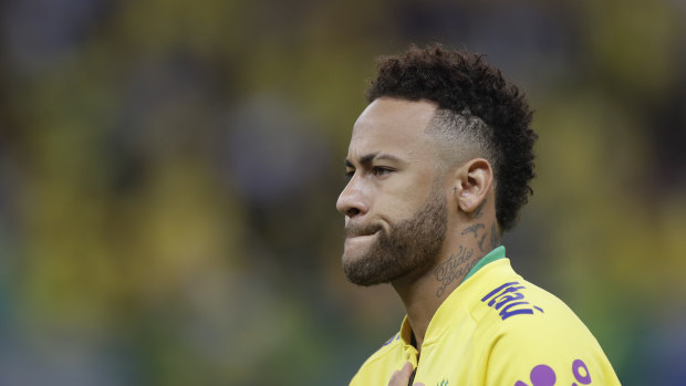 Brazil's Neymar during the national anthem, prior a friendly soccer match against Qatar at the Estadio Nacional in Brasilia on Wednesday.