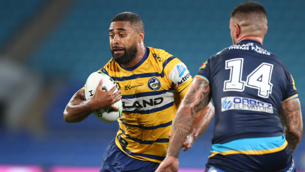 Michael Jennings of the Eels takes on the Titans defence in Parramatta's victory on Sunday.