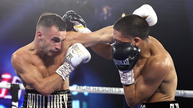 Andrew Moloney and Joshua Franco exchange punches during their controversial fight for the WBA super flyweight title on November 14.