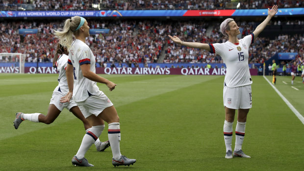 Megan Rapinoe, right, celebrates after scoring the US' first goal against France in the World Cup quarter finals.