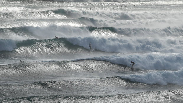 Huge swells and high tides are pummelling south-east Queensland beaches.