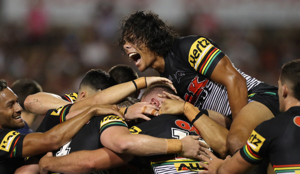 Jarome Luai celebrates with his Panthers teammates as they pile on the points without reply in round one.