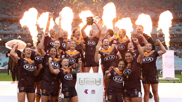 Ali Brigginshaw of the Broncos holds aloft the Premiership trophy as she celebrates with team mates their victory over the Sydney Roosters.