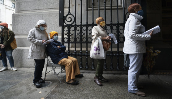 Voters wait to cast their ballots at City Hall, in Philadelphia, on Monday.