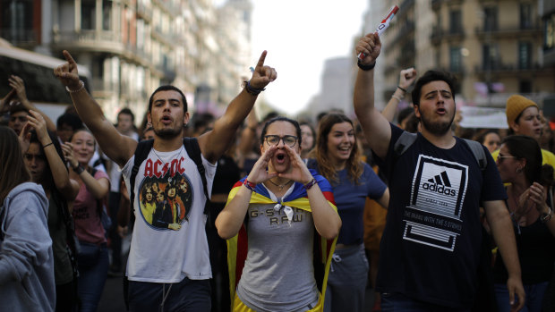 Protestors shout slogans in Barcelona, Spain over sentences handed down to Catalan separatists.