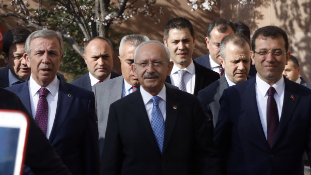 Ekrem Imamoglu, the main Turkish opposition Republican People's Party, CHP, candidate for Istanbul, right, arrive to address supporters, in Ankara.