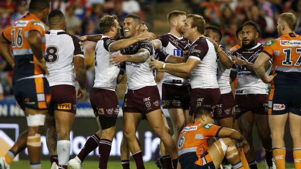 Early surge: Joel Thompson of the Sea Eagles  celebrates scoring a first-half try.
