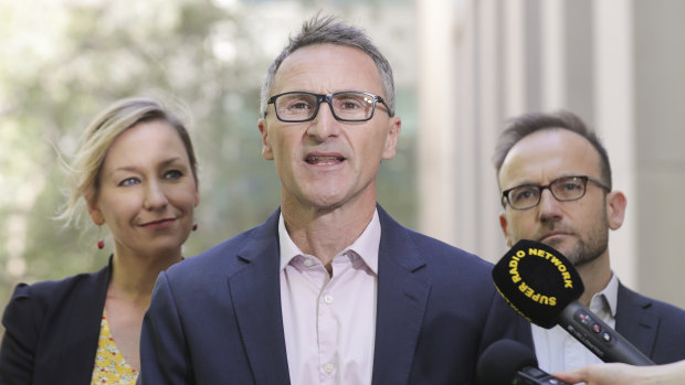 Adam Bandt, right, wants to run for the leadership on the Greens, replacing  Richard Di Natale, centre.