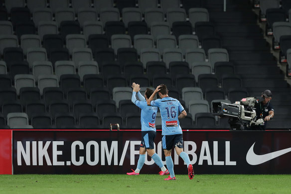 Sydney goalscorer Adam Le Fondre applauds to the empty stand at Bankwest Stadium.