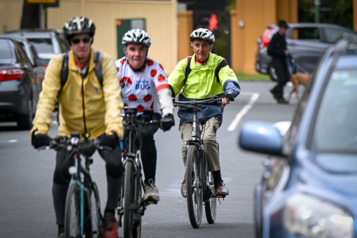 Kelvin Chamier (right) arrives at Churchill Cafe in Mont Albert after cycling for 15km from Heidelberg.