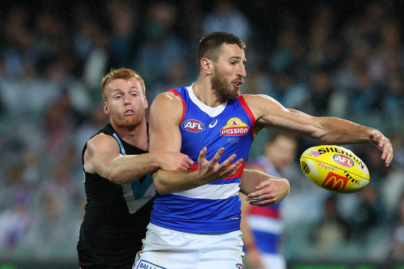 Marcus Bontempelli, right, spills a mark during round five. 