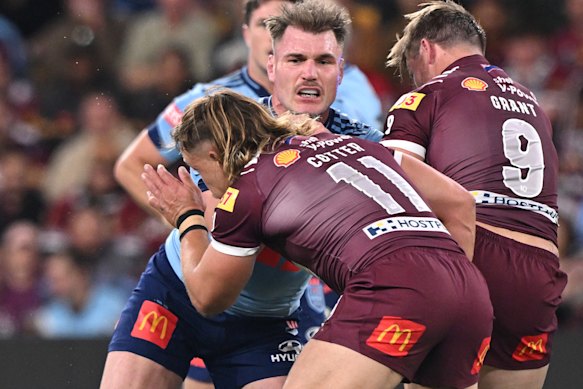 Overstretched: The Maroons’ jerseys lost their colour when pulled.