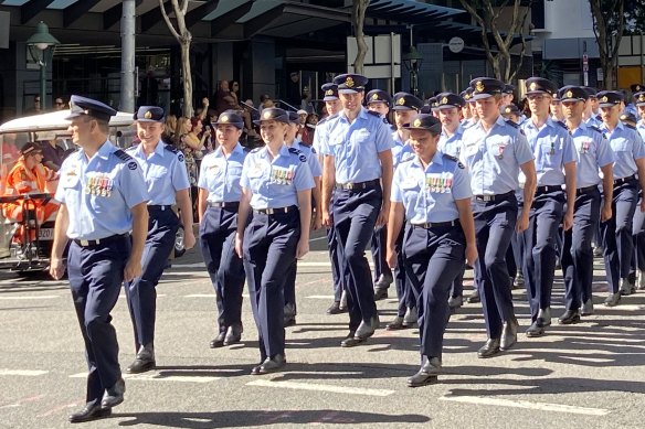 RAAF squadrons march along George Street during their centenary year.