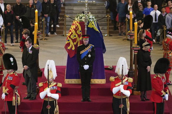 Prince William leads the vigil of the Queen’s grandchildren on Saturday in London.
