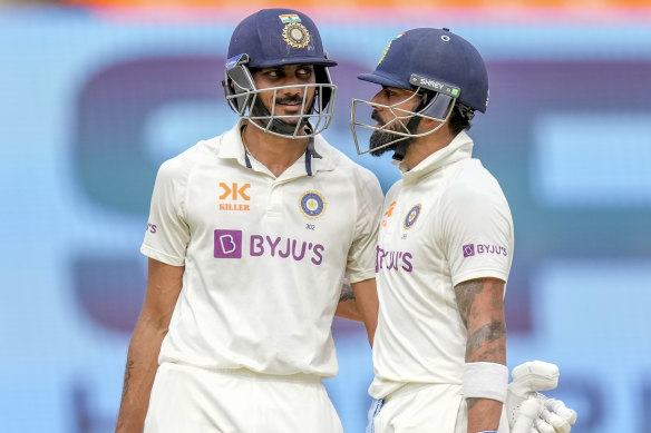 Virat Kohli (right) and Axar Patel have now put on 158 runs from 205 balls.