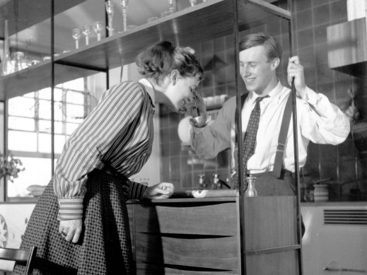 Designer Terence Conran, and his wfe Shirley looking at a new shelving design, 1955.