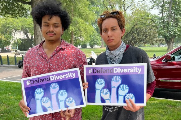 Students Elijah Estegec, left, and David Pacheco protest the Supreme Court ruling.