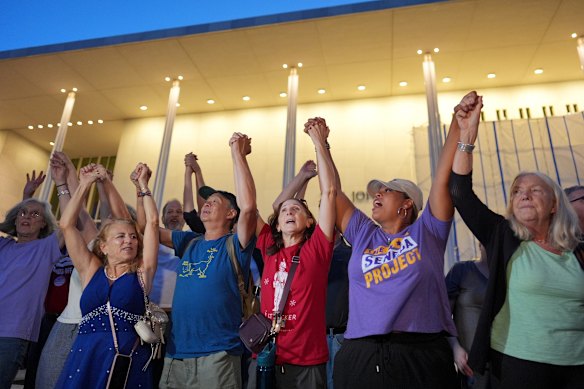 Protesters on Friday night linked hands to form a human chain around the Kennedy Centre.