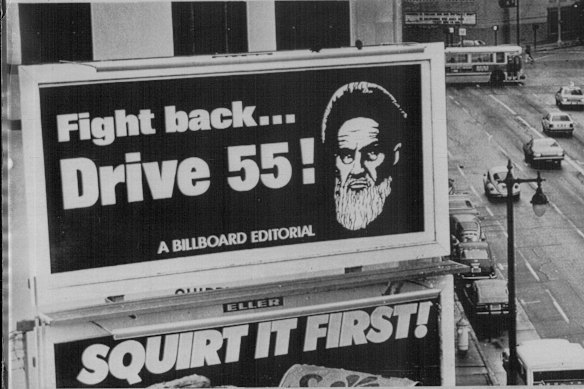San Francisco, January 1980: The image of Iran's Ayatollah Khomeini is used to encourage motorists to conserve petrol.