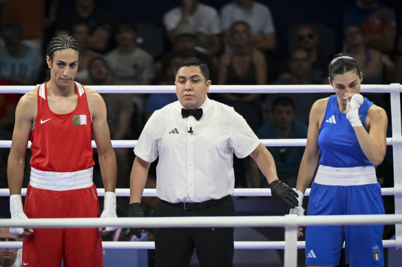 Italy’s Angela Carini fights back tears at the end of her aborted fight against Algeria’s Imane Khelif.