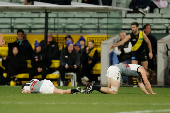 Zak Butters (left) and Tom Jonas after their collision on Thursday night.