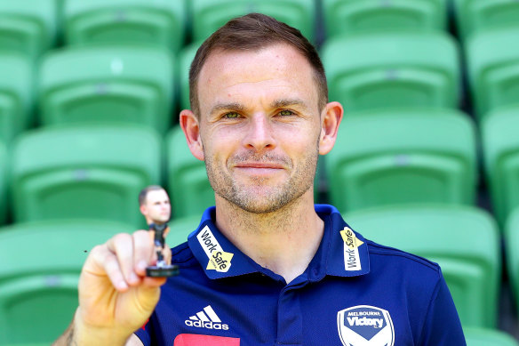 Leigh Broxham with a figurine of himself ahead of his 300th A-League game against Perth Glory.