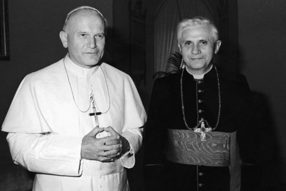 In this 1979 file photo, pope John Paul II, left, poses with then-Cardinal Joseph Ratzinger of Munich, who later became pope. 