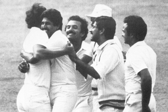 Indian captain Kapil Dev, second from left, hugs bowler Madan Lal during the 1983 World Cup final while the rest of the Indian team celebrate. 