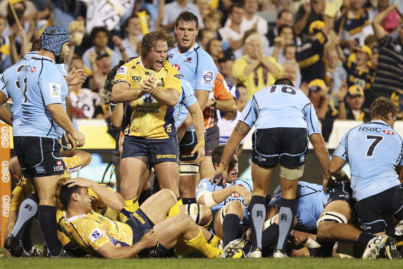 Dan Palmer celebrates a try in 2013 during his time at the Brumbies.