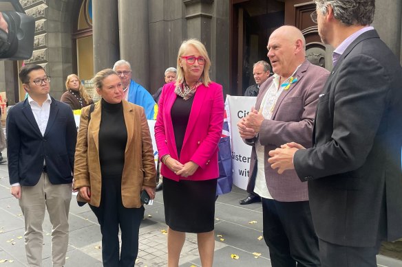 Representatives of the Ukrainian community in Melbourne meet with Lord Mayor Sally Capp outside Melbourne Town Hall on Tuesday afternoon ahead of Melbourne City Council’s decision to cut sister city ties with the Russian city of St Petersburg.
