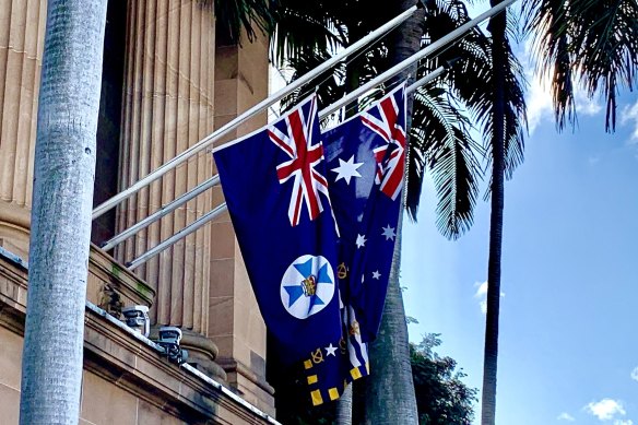 The Queensland flag, hanging at half mast alongide the Australian and Brisbane flags, on the day of Queen Elizabeth II’s death.