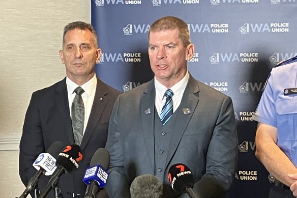 WA Police Union president Paul Gale (centre).