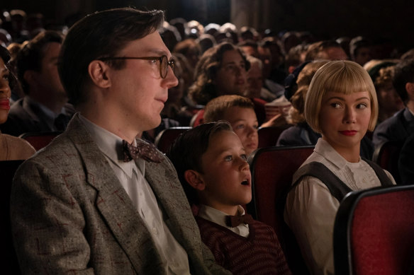 Young Sammy Fabelman, played by Mateo Zoryan Francis-DeFord, goes to the cinema for the first time with his parents, played by Paul Dano and Michelle Williams.